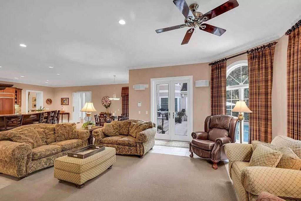 The Home in Georgia is a luxurious home offering impressive foyer, gracious living room and spacious dining room now available for sale. This home located at 23 Carriage Dr, Saint Simons Island, Georgia; offering 07 bedrooms and 08 bathrooms with 10,688 square feet of living spaces.