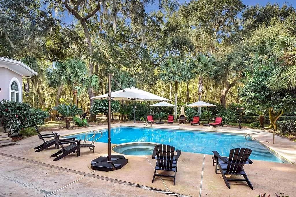 The Home in Georgia is a luxurious home offering impressive foyer, gracious living room and spacious dining room now available for sale. This home located at 23 Carriage Dr, Saint Simons Island, Georgia; offering 07 bedrooms and 08 bathrooms with 10,688 square feet of living spaces.