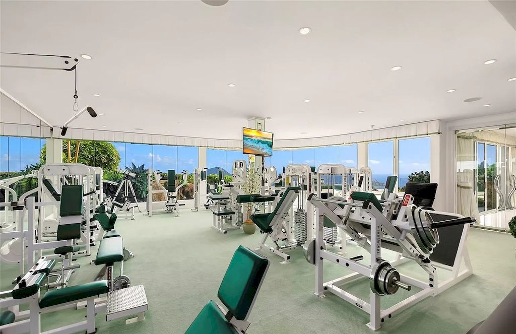The Home in Hawaii is a luxurious home offering unprecedented privacy combined with sophisticated, cosmopolitan lifestyle now available for sale. This home located at 828 Moaniala St, Honolulu, Hawaii; offering 05 bedrooms and 09 bathrooms with 8,424 square feet of living spaces.