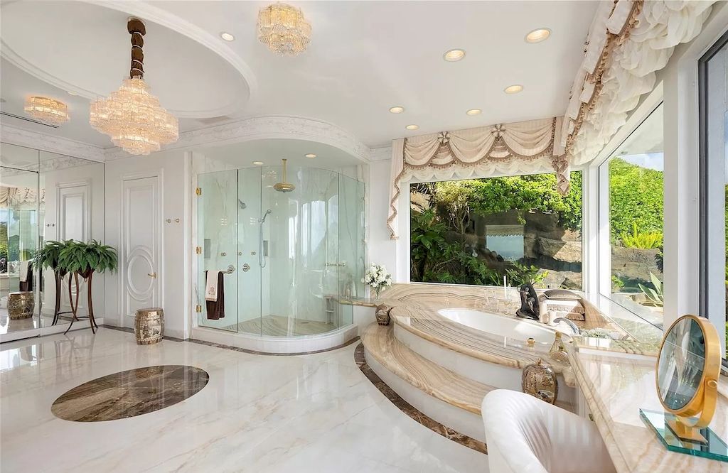 The Home in Hawaii is a luxurious home offering unprecedented privacy combined with sophisticated, cosmopolitan lifestyle now available for sale. This home located at 828 Moaniala St, Honolulu, Hawaii; offering 05 bedrooms and 09 bathrooms with 8,424 square feet of living spaces.