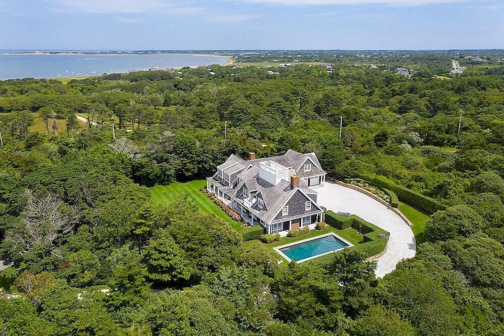 The Home in Massachusetts is a luxurious home concealed by mature and thoughtfully designed gardens now available for sale. This home located at 1 Shawkemo Hills Ln, Nantucket, MA 02554, Massachusetts; offering 06 bedrooms and 09 bathrooms with 8,139 square feet of living spaces.