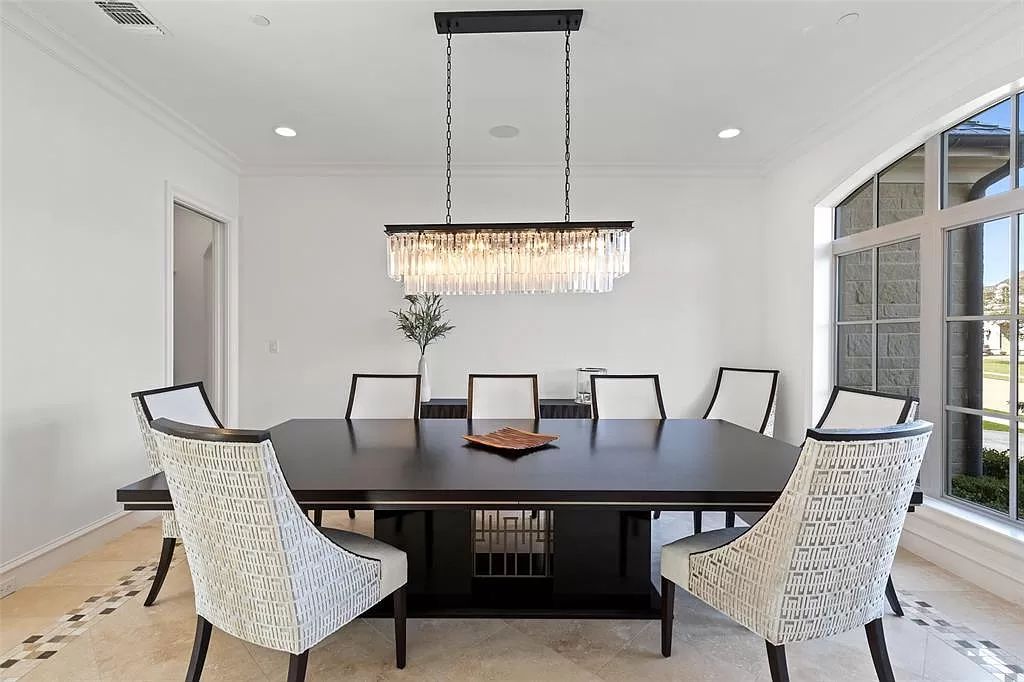 The Home in Allen set on the Twin Creeks Golf Course on a gated community boasts luxurious finishes with exceptional detail now available for sale. This home located at 413 Woodlake Dr, Allen, Texas