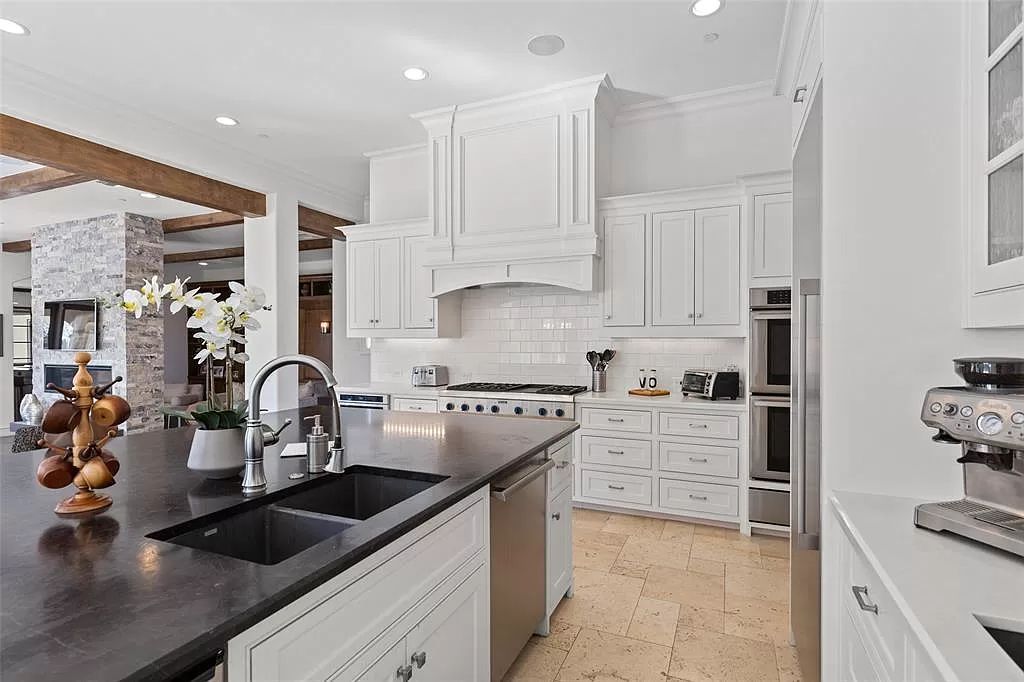 The Home in Allen set on the Twin Creeks Golf Course on a gated community boasts luxurious finishes with exceptional detail now available for sale. This home located at 413 Woodlake Dr, Allen, Texas