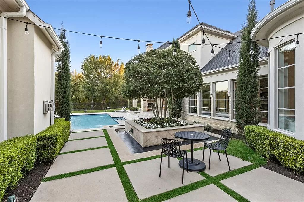 The Home in Allen set on the Twin Creeks Golf Course on a gated community boasts luxurious finishes with exceptional detail now available for sale. This home located at 413 Woodlake Dr, Allen, Texas
