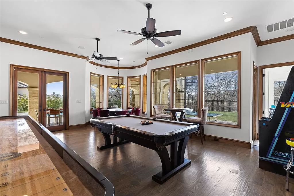 The Home in Allen set on the Twin Creeks Golf Course on a gated community boasts luxurious finishes with exceptional detail now available for sale. This home located at 413 Woodlake Dr, Allen, Texas