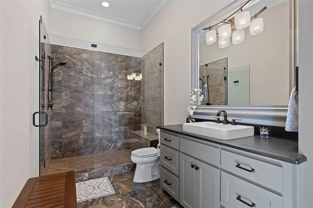 The Home in Allen set on the Twin Creeks Golf Course on a gated community boasts luxurious finishes with exceptional detail now available for sale. This home located at 413 Woodlake Dr, Allen, Texas
