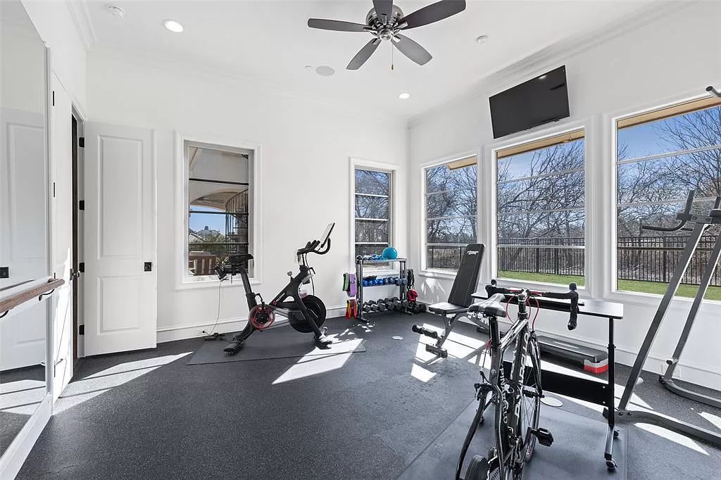 The Home in Allen set on the Twin Creeks Golf Course on a gated community boasts luxurious finishes with exceptional detail now available for sale. This home located at 413 Woodlake Dr, Allen, Texas