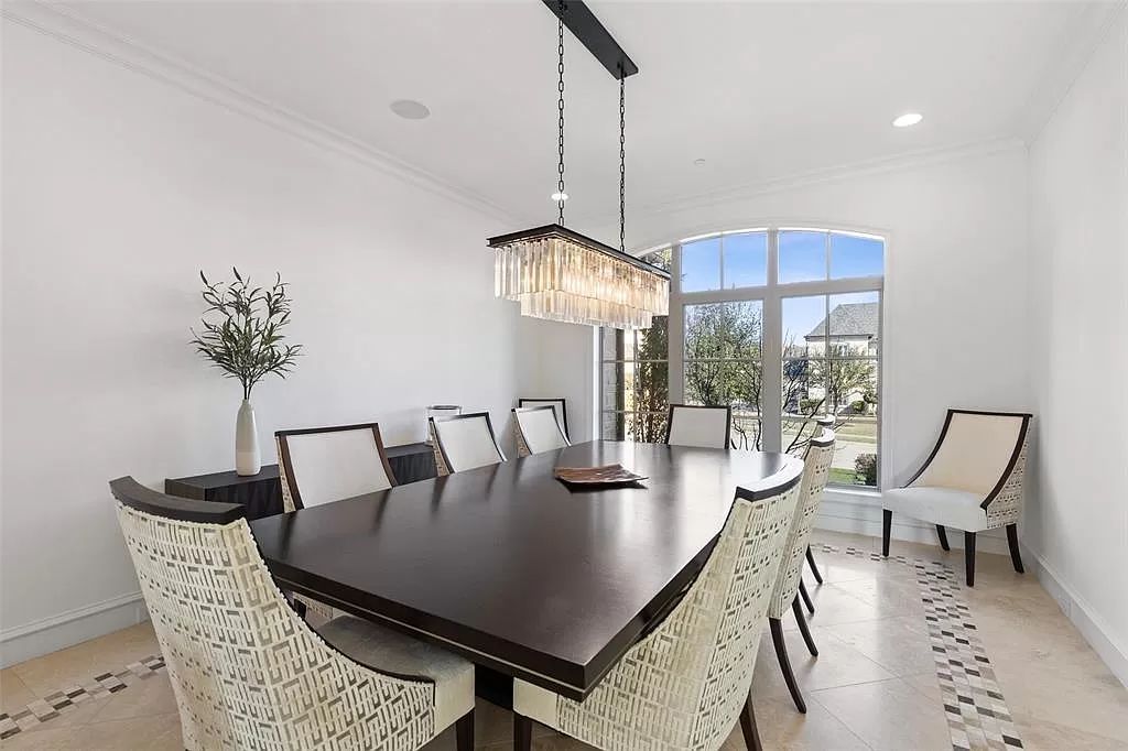 The Home in Allen set on the Twin Creeks Golf Course on a gated community boasts luxurious finishes with exceptional detail now available for sale. This home located at 413 Woodlake Dr, Allen, Texas