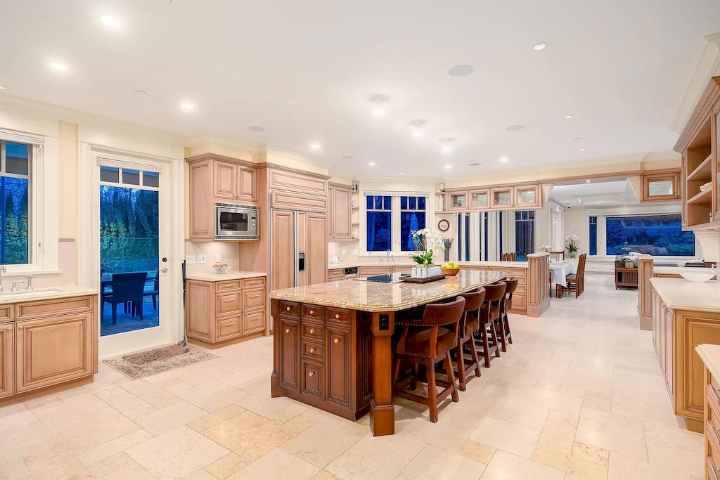 The House in Vancouver has exceptionally landscaped outdoor grounds feature a full size tennis court, a mini golf putting green, a Japanese Zen garden, now available for sale