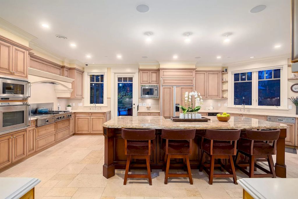 The House in Vancouver has exceptionally landscaped outdoor grounds feature a full size tennis court, a mini golf putting green, a Japanese Zen garden, now available for sale