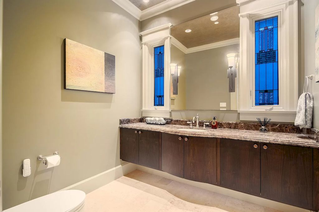 The House in Vancouver has exceptionally landscaped outdoor grounds feature a full size tennis court, a mini golf putting green, a Japanese Zen garden, now available for sale