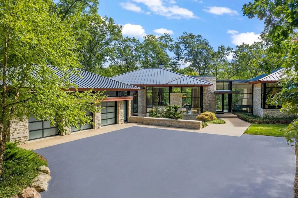The Home in Michigan is a luxurious home having full stone exterior now available for sale. This home located at 6956 Cooley Lake Rd, White Lake, Michigan; offering 05 bedrooms and 05 bathrooms with 7,153 square feet of living spaces.