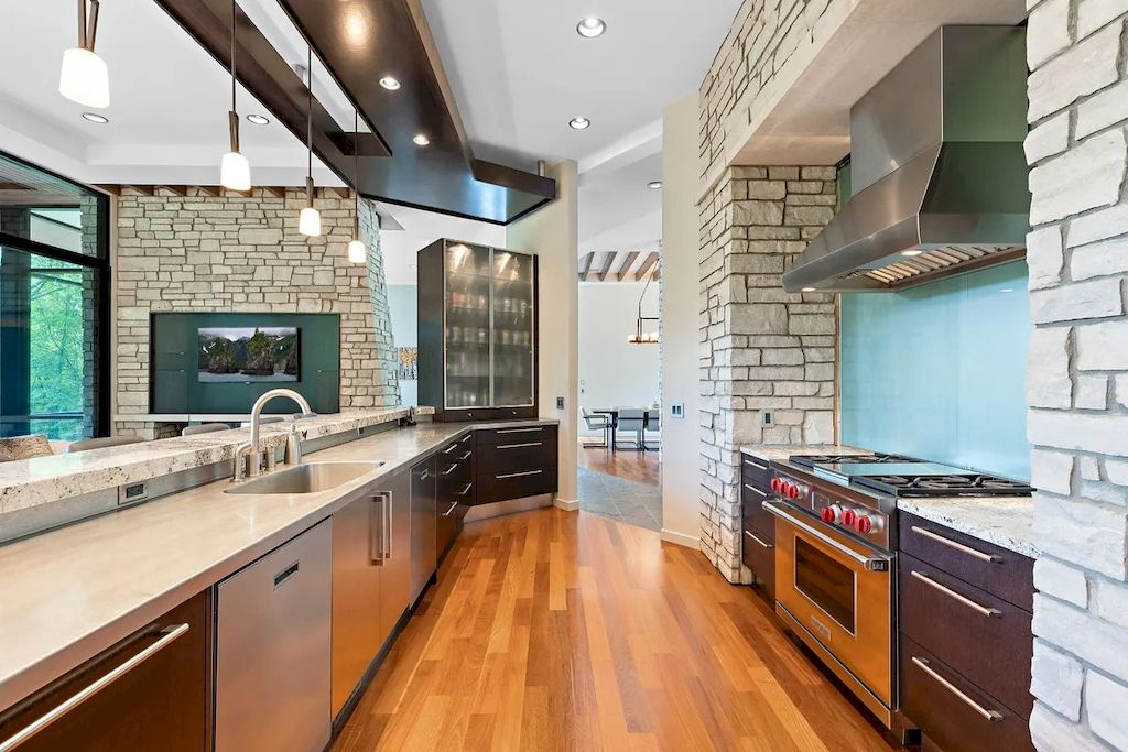 The Home in Michigan is a luxurious home having full stone exterior now available for sale. This home located at 6956 Cooley Lake Rd, White Lake, Michigan; offering 05 bedrooms and 05 bathrooms with 7,153 square feet of living spaces.