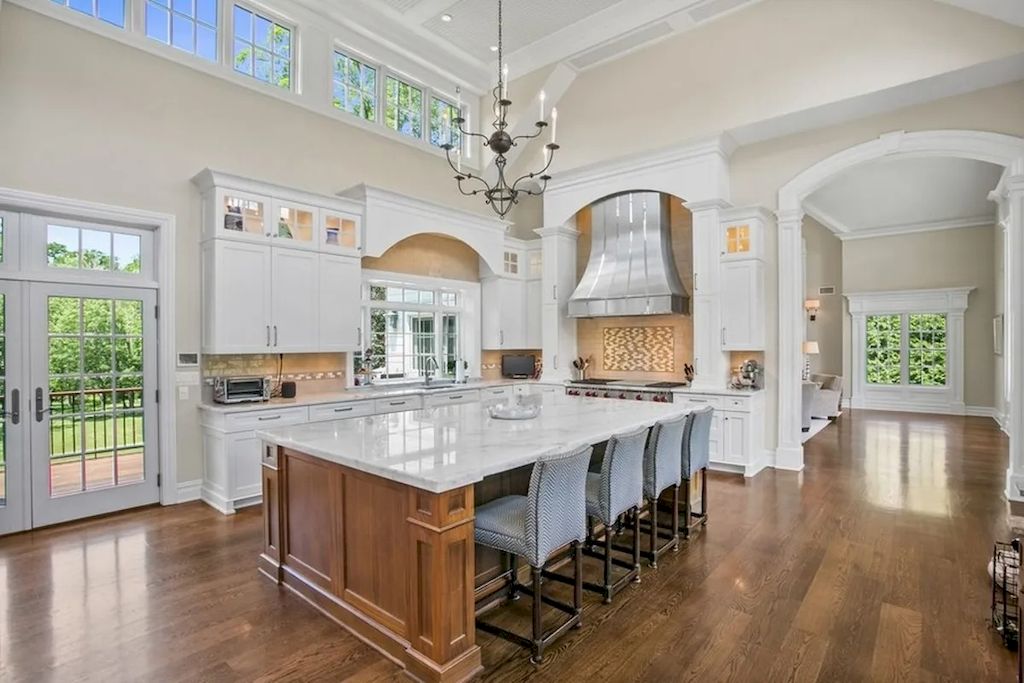 The Home in New Jersey is a luxurious farmhouse compounds featuring soaring ceilings, glass walls, a beautiful pool, a gallery and more now available for sale. This home located at 255 E Saddle River Rd, Saddle River, New Jersey; offering 06 bedrooms and 07 bathrooms with approximately 10 acres of land.