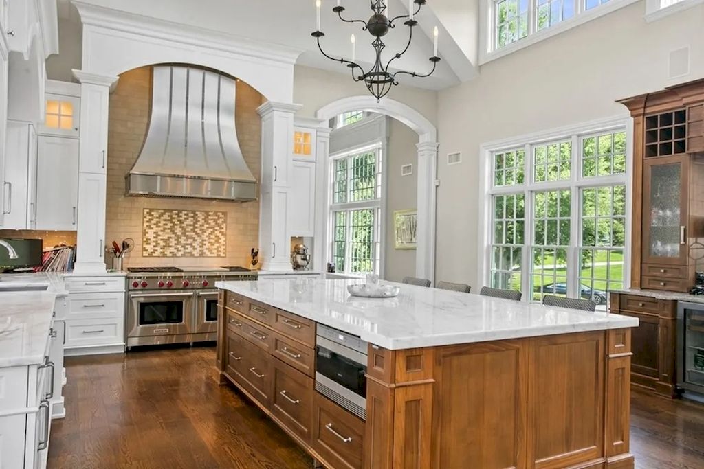 The Home in New Jersey is a luxurious farmhouse compounds featuring soaring ceilings, glass walls, a beautiful pool, a gallery and more now available for sale. This home located at 255 E Saddle River Rd, Saddle River, New Jersey; offering 06 bedrooms and 07 bathrooms with approximately 10 acres of land.