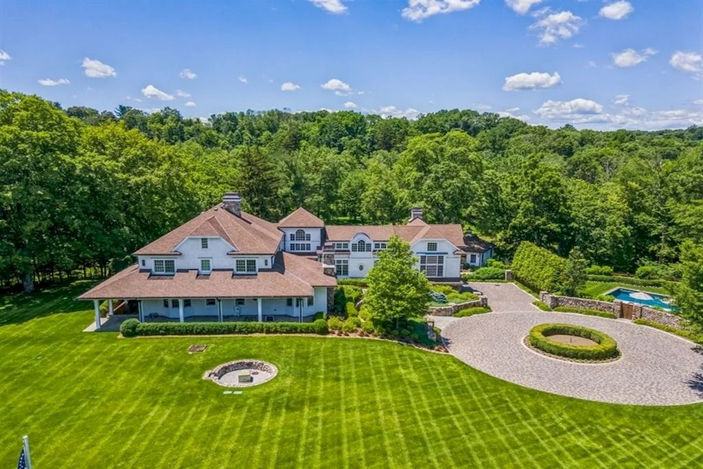 The Home in New Jersey is a luxurious farmhouse compounds featuring soaring ceilings, glass walls, a beautiful pool, a gallery and more now available for sale. This home located at 255 E Saddle River Rd, Saddle River, New Jersey; offering 06 bedrooms and 07 bathrooms with approximately 10 acres of land.
