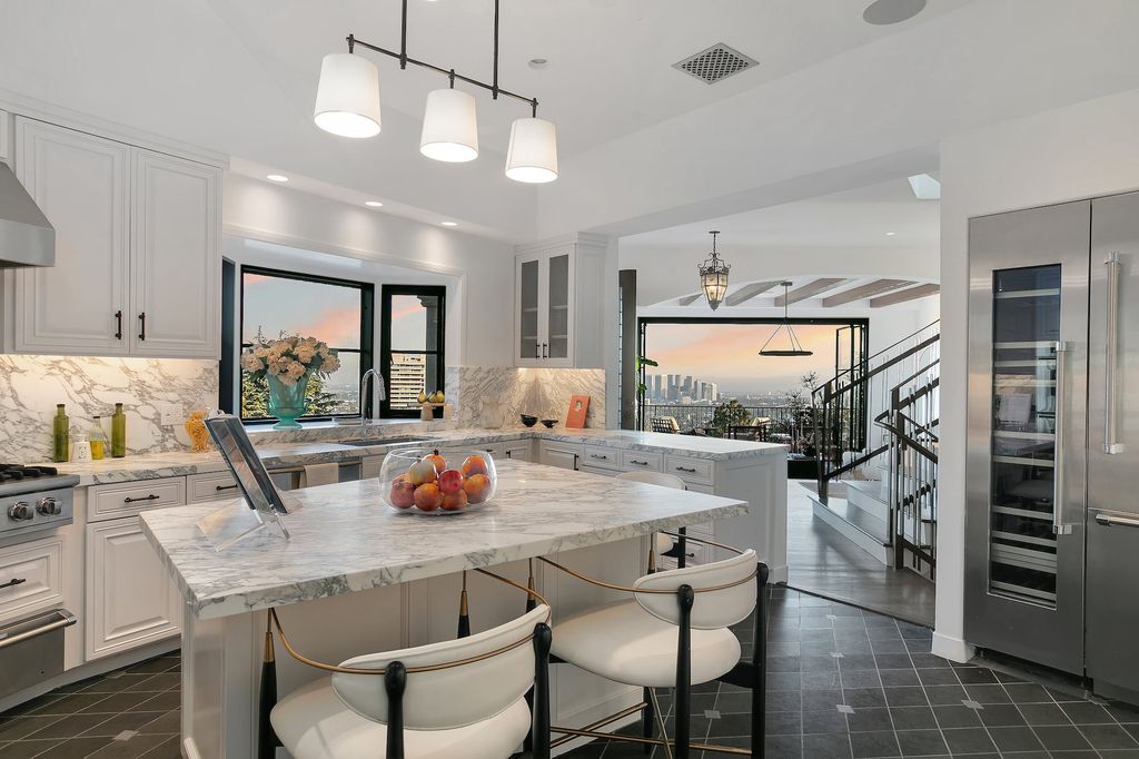 The Villa in Los Angeles is a newly built compound with separate guest house and pool bath perfect for for entertaining now available for sale. This home located at 9368 Flicker Way, Los Angeles, California