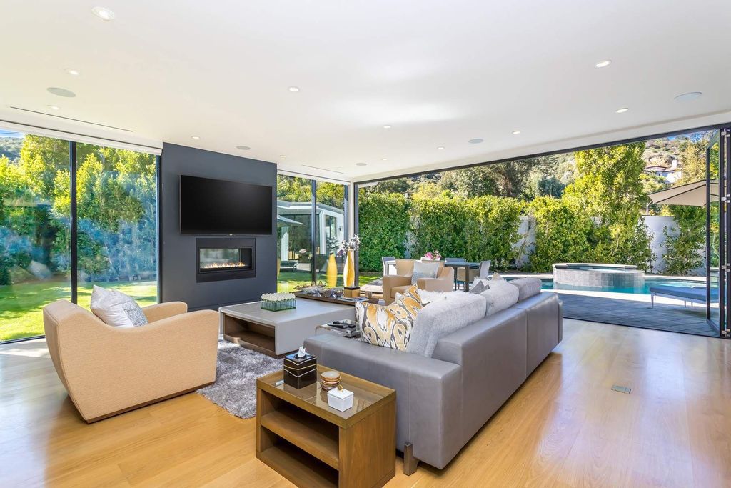 The Home in Beverly Hills is a stunning contemporary compound in a coveted lower Coldwater Canyon now available for sale. This home located at 9565 Cherokee Ln, Beverly Hills, California