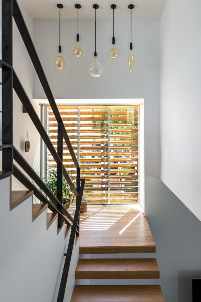 Spa creek house with harmony of private & public space by GriD Architects