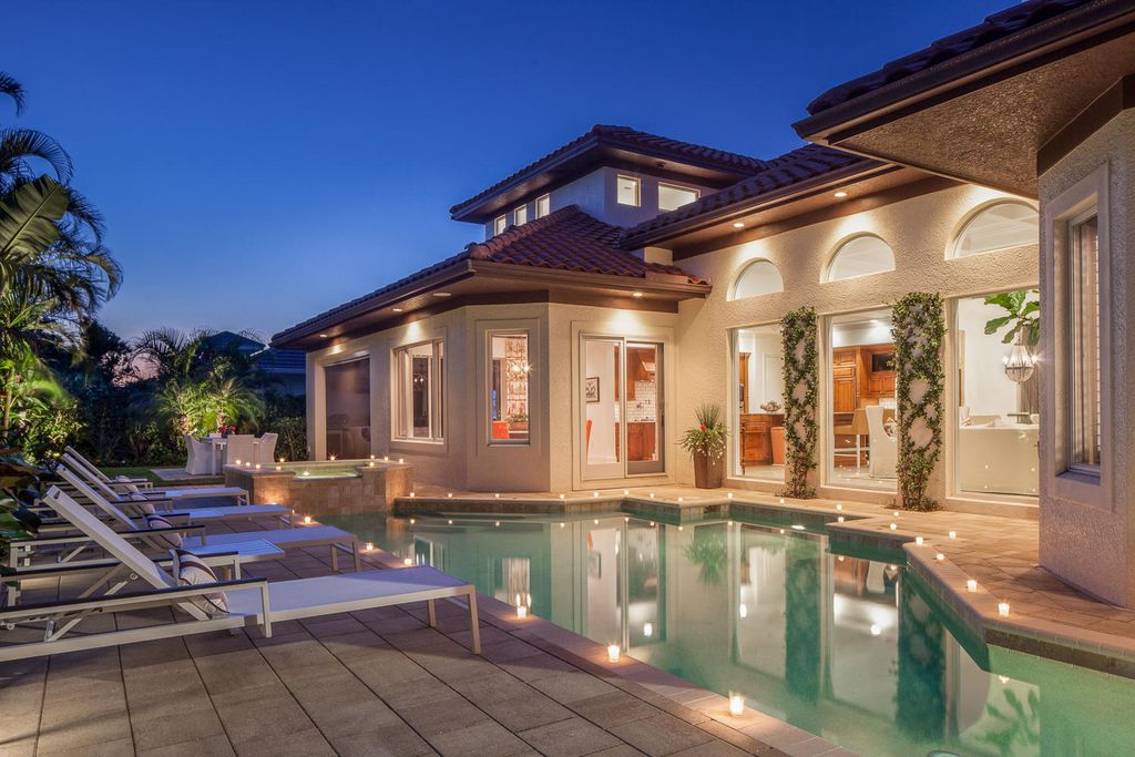 The Home in Naples is a custom residence with glorious southern exposure, soaring ceilings and floor to ceiling windows now available for sale. This home located at 750 Fountainhead Ln, Naples, Florida