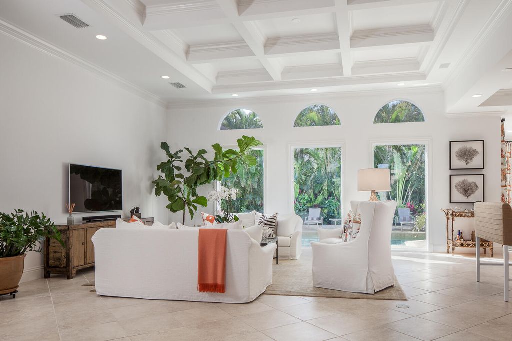 The Home in Naples is a custom residence with glorious southern exposure, soaring ceilings and floor to ceiling windows now available for sale. This home located at 750 Fountainhead Ln, Naples, Florida