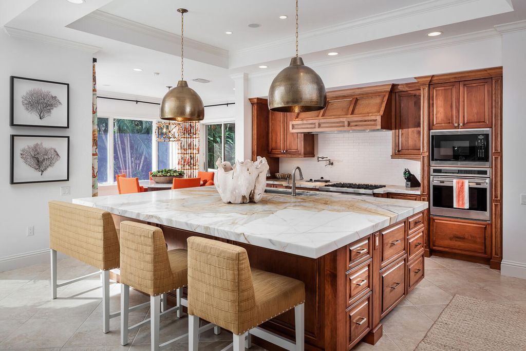 The Home in Naples is a custom residence with glorious southern exposure, soaring ceilings and floor to ceiling windows now available for sale. This home located at 750 Fountainhead Ln, Naples, Florida