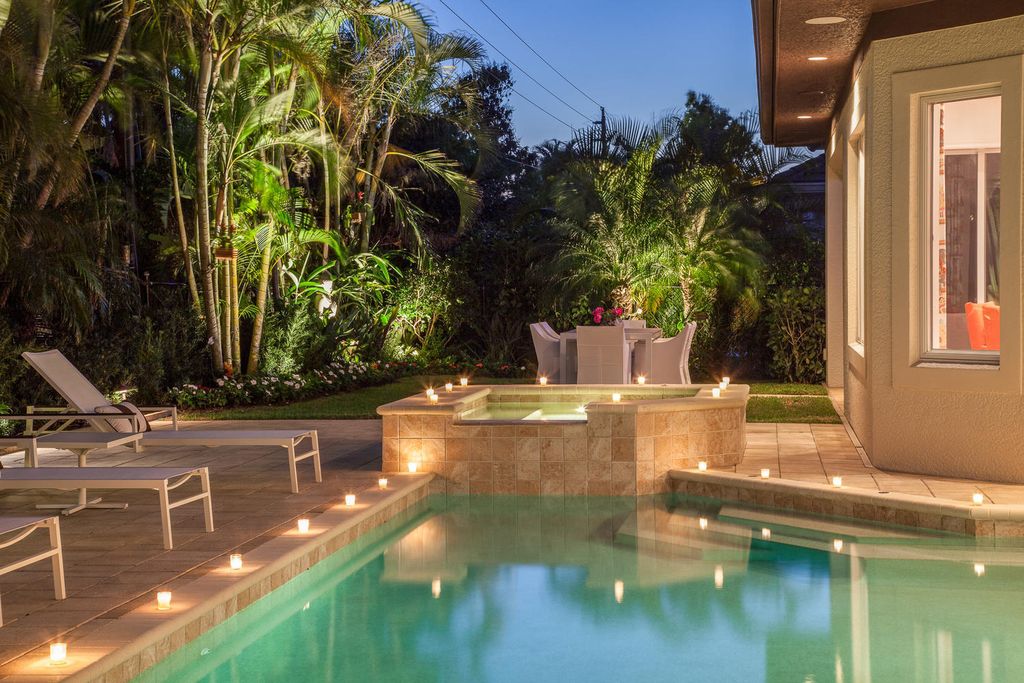 The Home in Naples is a custom residence with glorious southern exposure, soaring ceilings and floor to ceiling windows now available for sale. This home located at 750 Fountainhead Ln, Naples, Florida