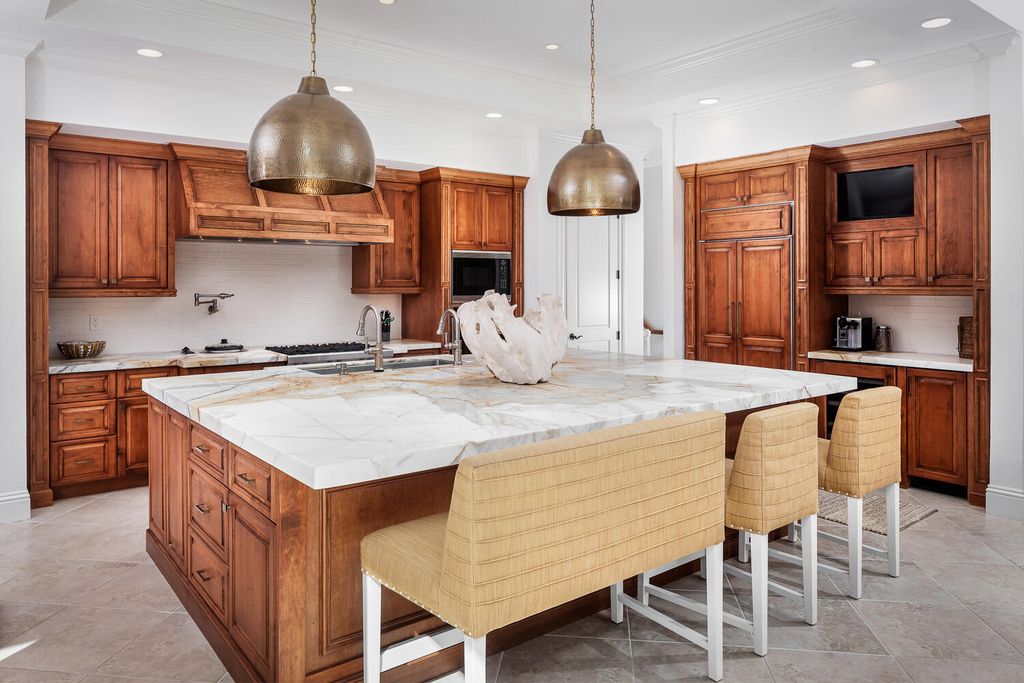 The Home in Naples is a custom residence with glorious southern exposure, soaring ceilings and floor to ceiling windows now available for sale. This home located at 750 Fountainhead Ln, Naples, Florida