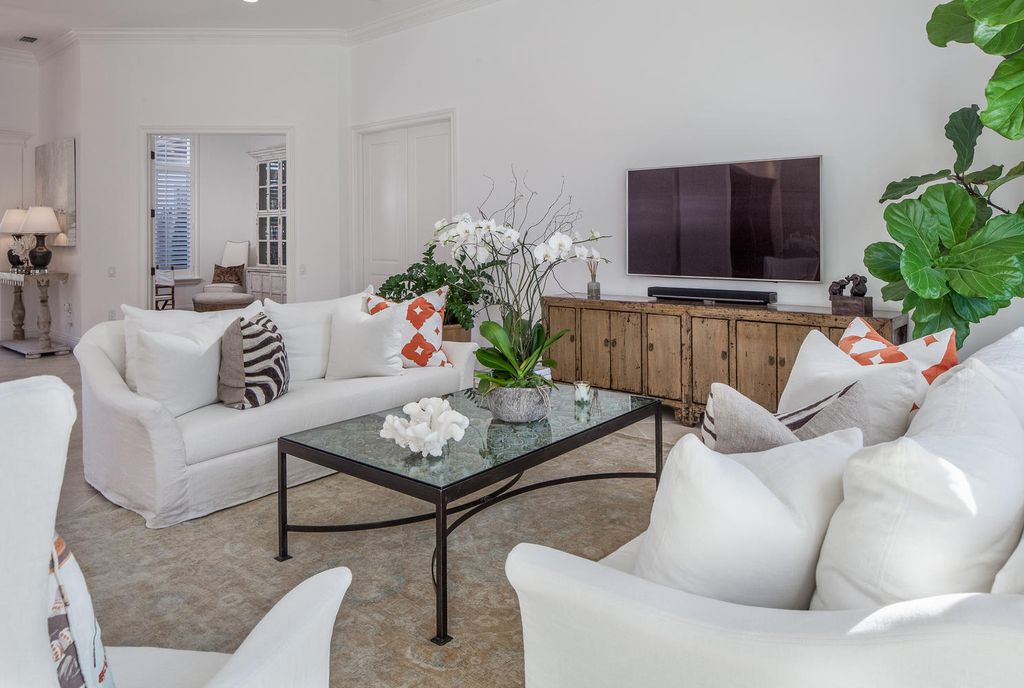 The Home in Naples is a custom residence with glorious southern exposure, soaring ceilings and floor to ceiling windows now available for sale. This home located at 750 Fountainhead Ln, Naples, Florida