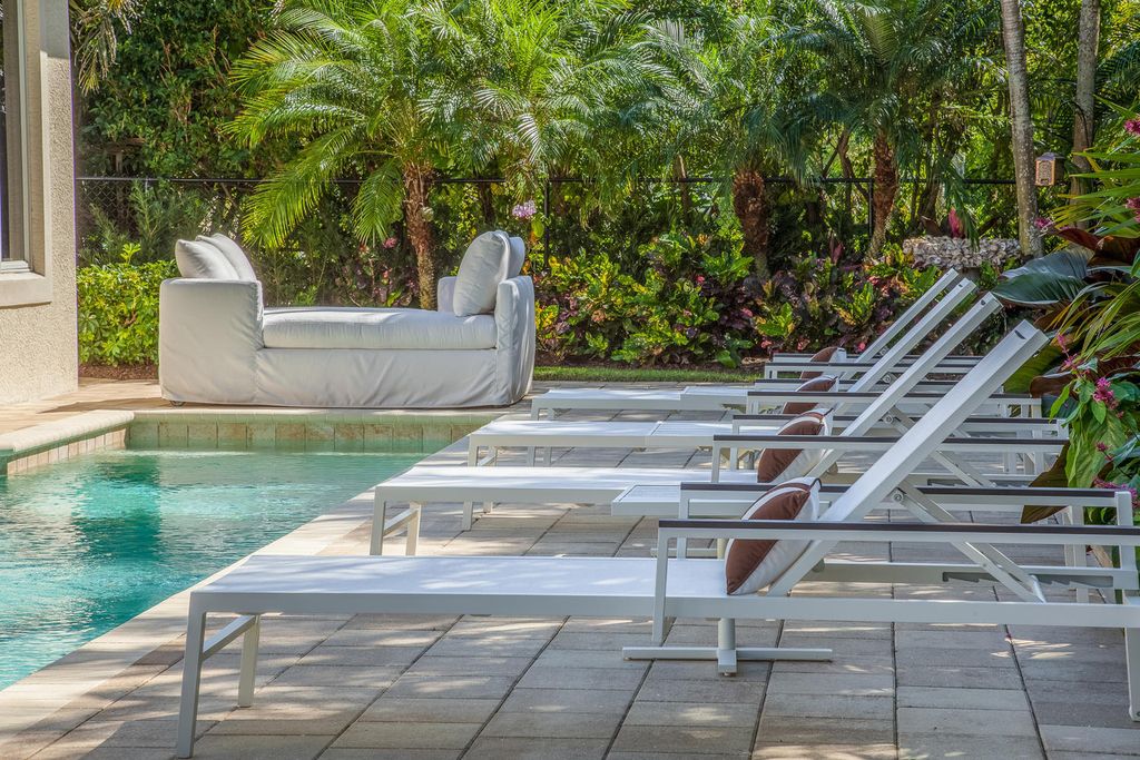 The Home in Naples is a custom residence with glorious southern exposure, soaring ceilings and floor to ceiling windows now available for sale. This home located at 750 Fountainhead Ln, Naples, Florida