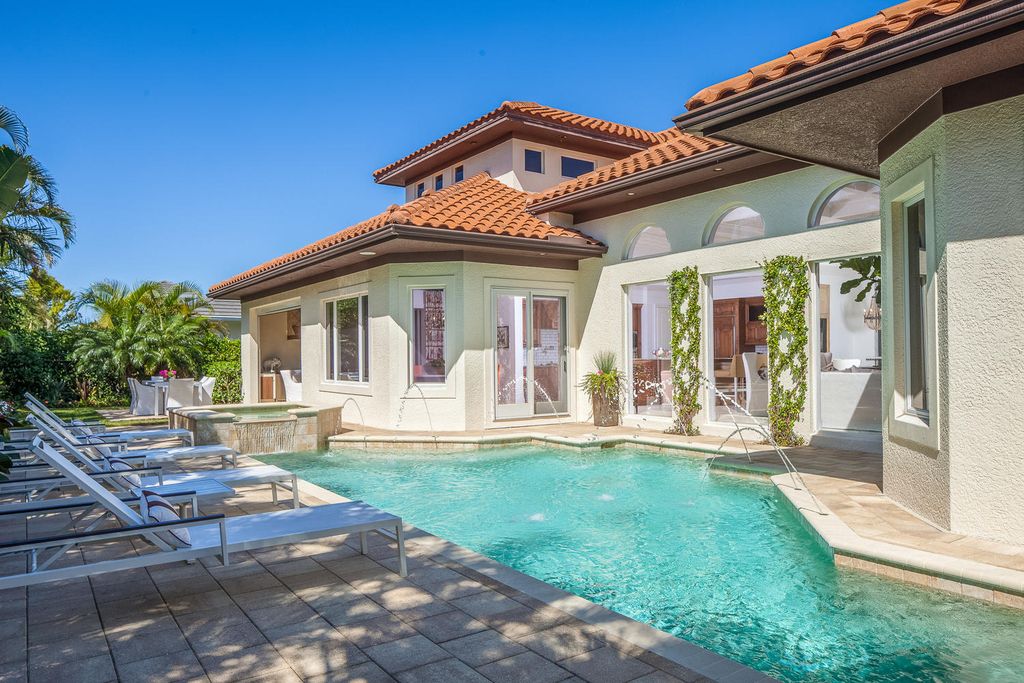 The Home in Naples is a custom residence with glorious southern exposure, soaring ceilings and floor to ceiling windows now available for sale. This home located at 750 Fountainhead Ln, Naples, Florida