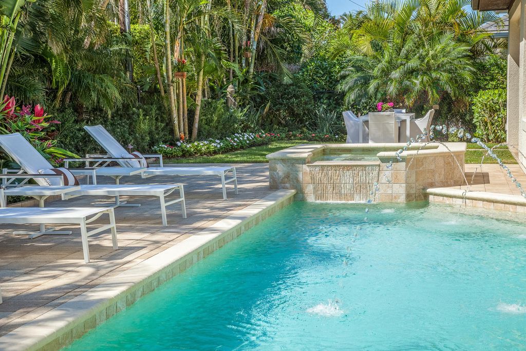 The Home in Naples is a custom residence with glorious southern exposure, soaring ceilings and floor to ceiling windows now available for sale. This home located at 750 Fountainhead Ln, Naples, Florida