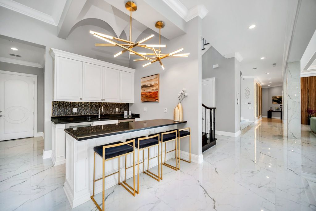 The Home in Reunion is a stunning fully furnished residence has an open contemporary floor plan which exudes luxury now available for sale. This home located at 521 Muirfield Loop, Reunion, Florida