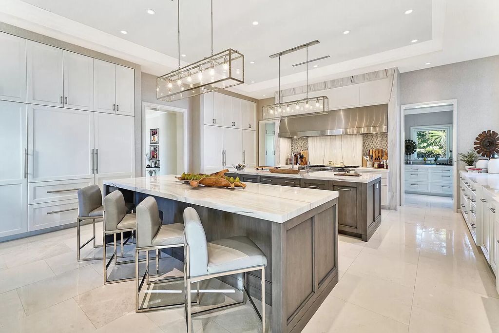 The Lake Worth Mansion is a contemporary South Florida ultra luxury waterfront real estate masterpiece boasting unparalleled resort inspired comforts now available for sale. This home located at 1400 S Ocean Blvd, Lake Worth, Florida