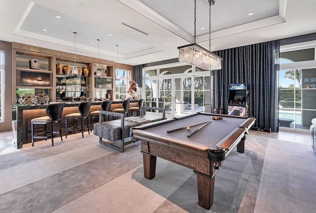 The Lake Worth Mansion is a contemporary South Florida ultra luxury waterfront real estate masterpiece boasting unparalleled resort inspired comforts now available for sale. This home located at 1400 S Ocean Blvd, Lake Worth, Florida