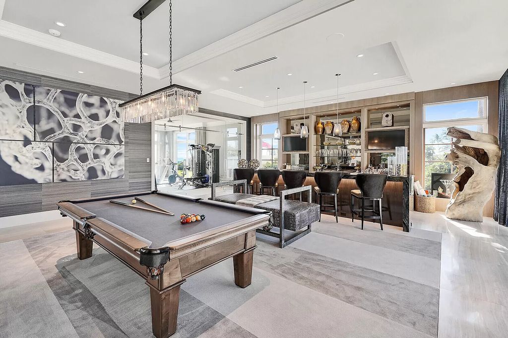 The Lake Worth Mansion is a contemporary South Florida ultra luxury waterfront real estate masterpiece boasting unparalleled resort inspired comforts now available for sale. This home located at 1400 S Ocean Blvd, Lake Worth, Florida
