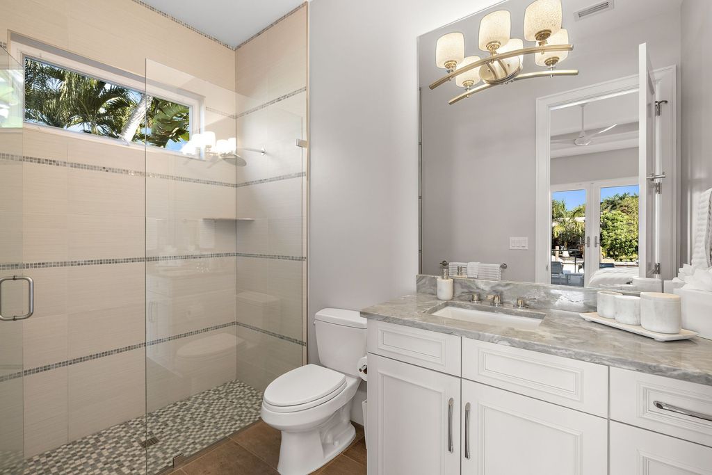 The Home in Naples is a sleek estate with a spacious interior and exquisite finishes on every surface now available for sale. This home located at 1275 Wahoo Ct, Naples, Florida