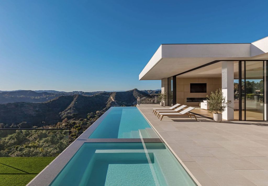 The Mansion in Beverly Hills is a serene architectural masterpiece sitting on the best lot in the ultra-exclusive Trousdale Estates enclave now available for sale. This home located at 620 Arkell Dr, Beverly Hills, California