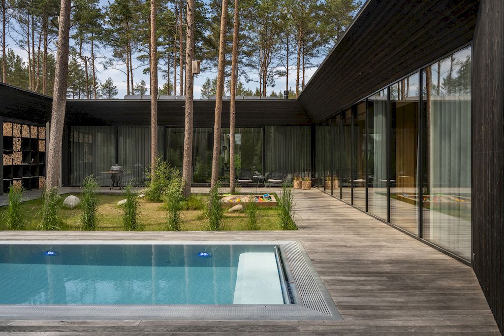 U shaped House Estonian wraps around a private garden by Kuu Arhitektid 13