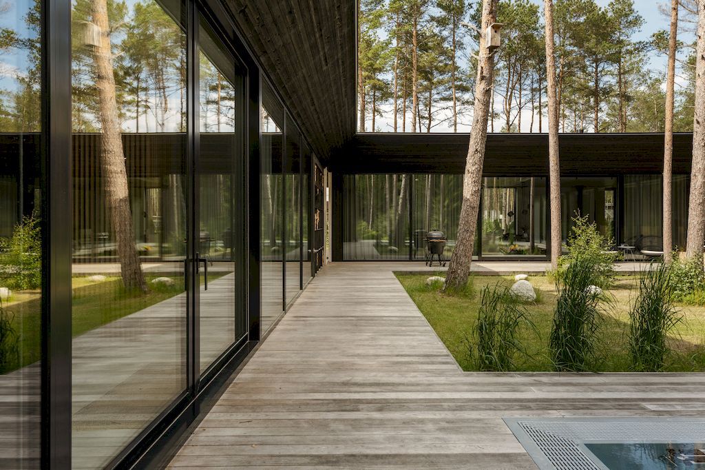 U shaped House Estonian wraps around a private garden by Kuu Arhitektid 7