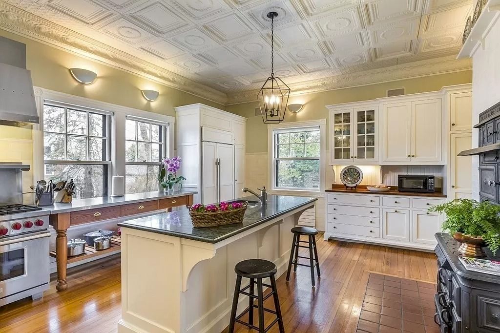 The Home in Massachusetts is a luxurious home having elegant rooms with carved-oak staircase, cherry-paneled and oak-paneled walls now available for sale. This home located at 16 Fairmont Ave, Newton, Massachusetts; offering 07 bedrooms and 07 bathrooms with 8,542 square feet of living spaces.