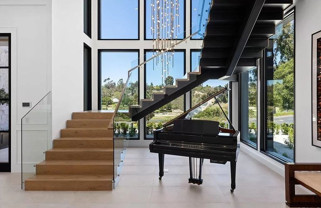 The Home in Rancho Santa Fe is a newly built estate with exquisite bespoke designer finishes and spectacular outdoor spaces now available for sale. This home located at 6395 Clubhouse Dr, Rancho Santa Fe, California
