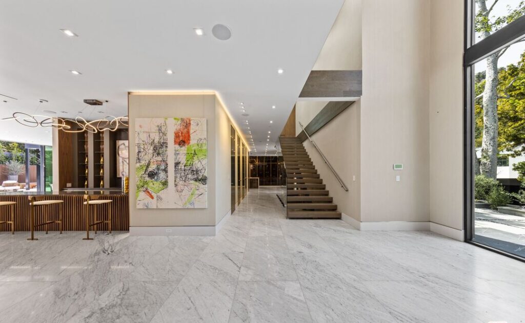 The Home in Los Angeles is an architectural triumph situated in a prestigious lower Bel Air location was built using the finest materials and utmost attention to detail now available for sale. This home located at 120 N Glenroy Ave, Los Angeles, California