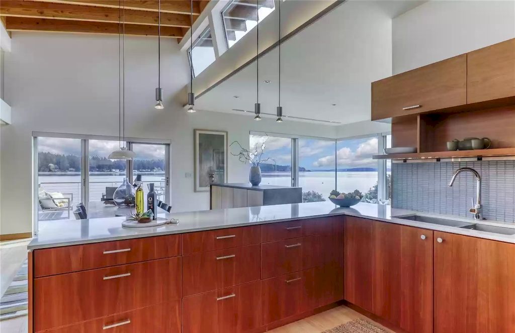 The Estate in Washington is a luxurious home newly refinished with bamboo floors and a combination of metal and green roofs now available for sale. This home located at 4000 Point White Drive NE, Bainbridge Island, Washington; offering 02 bedrooms and 03 bathrooms with 3,396 square feet of living spaces.
