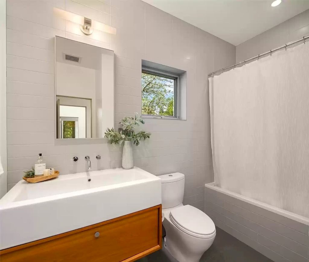 The Estate in Washington is a luxurious home newly refinished with bamboo floors and a combination of metal and green roofs now available for sale. This home located at 4000 Point White Drive NE, Bainbridge Island, Washington; offering 02 bedrooms and 03 bathrooms with 3,396 square feet of living spaces.