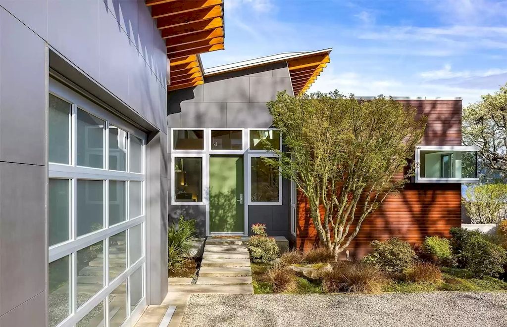 The Estate in Washington is a luxurious home newly refinished with bamboo floors and a combination of metal and green roofs now available for sale. This home located at 4000 Point White Drive NE, Bainbridge Island, Washington; offering 02 bedrooms and 03 bathrooms with 3,396 square feet of living spaces.