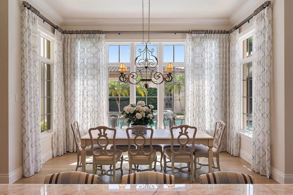 The Home in Palm Beach Gardens is a signature custom estate with amazing views and outdoor entertainment areas now available for sale. This house located at 11770 Calleta Ct, Palm Beach Gardens, Florida