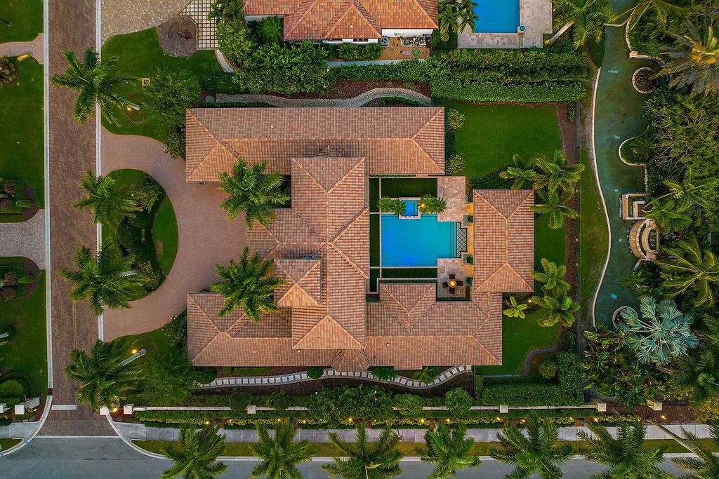 The Home in Palm Beach Gardens is a signature custom estate with amazing views and outdoor entertainment areas now available for sale. This house located at 11770 Calleta Ct, Palm Beach Gardens, Florida