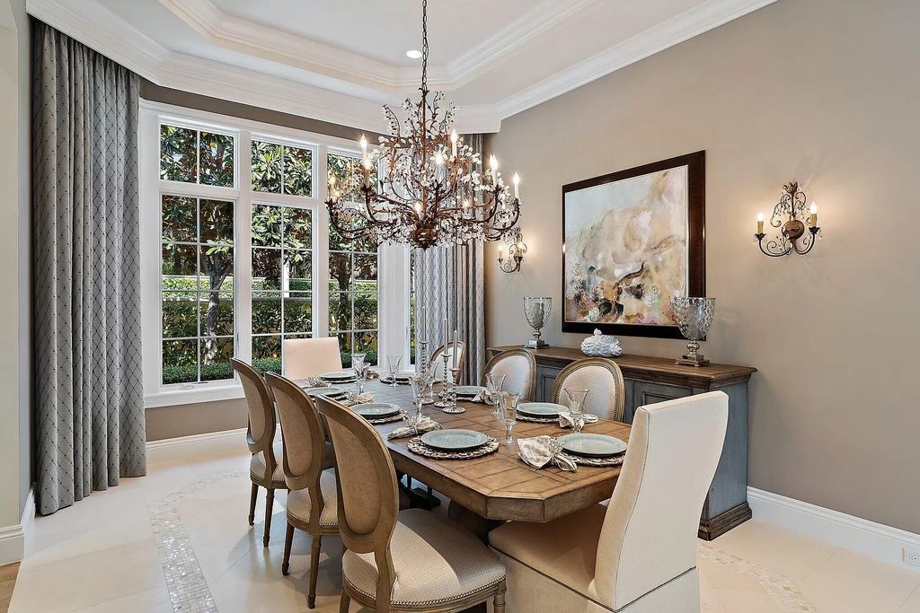 The Home in Palm Beach Gardens is a signature custom estate with amazing views and outdoor entertainment areas now available for sale. This house located at 11770 Calleta Ct, Palm Beach Gardens, Florida