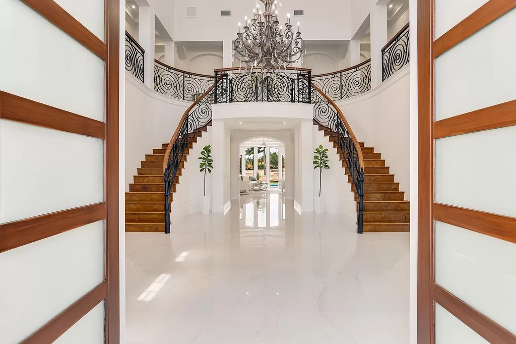 The Home in Boca Raton is a Two story Transitional Contemporary with exceptional water and expansive golf course vistas of the Fazio west golf course now available for sale. This home located at 7645 Fenwick Pl, Boca Raton, Florida